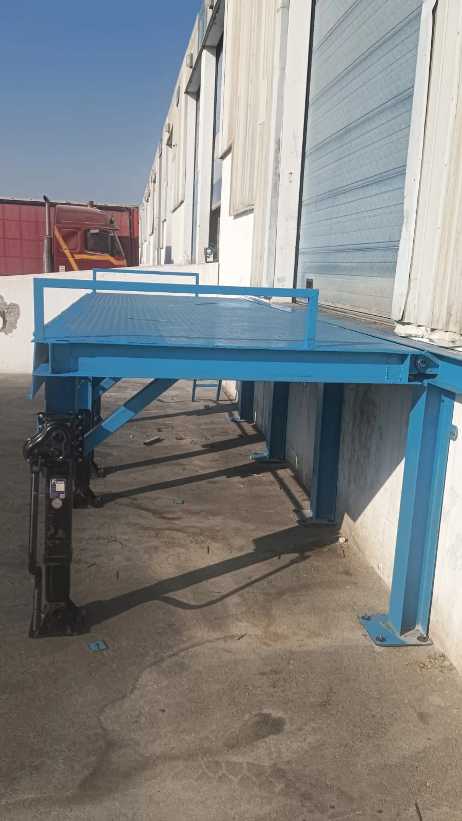 Dock leveller and support frame