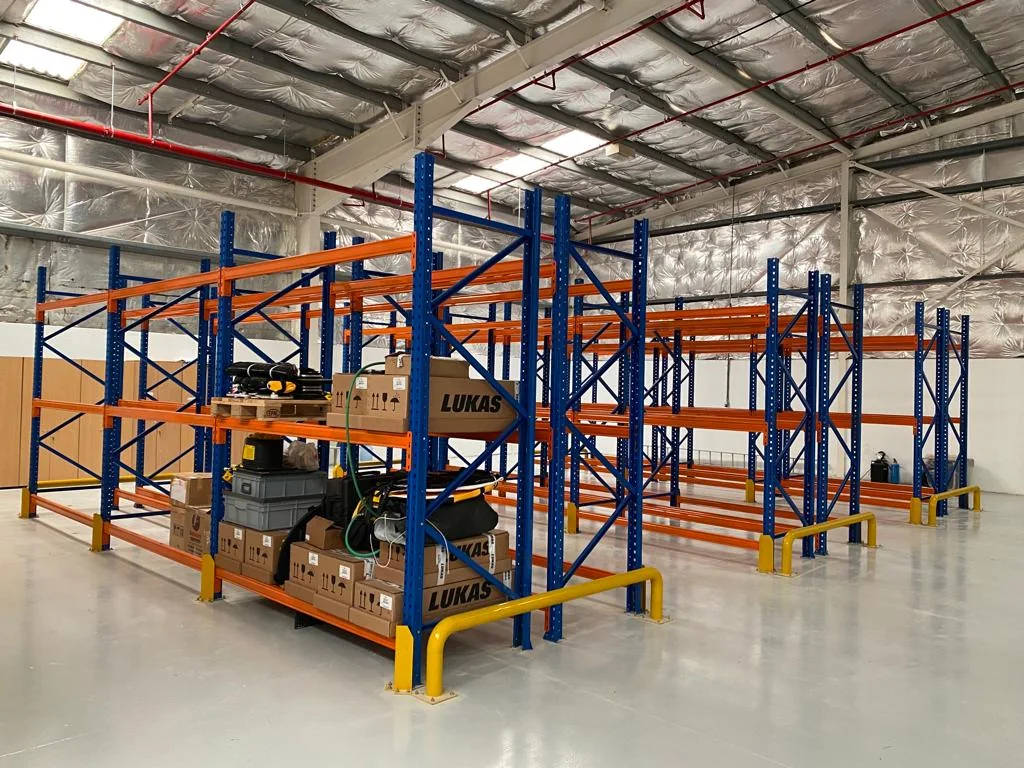 Installed warehouse pallet racking system with protective barriers